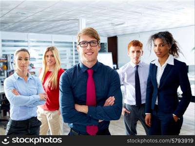 Blond young businessman multi ethnic teamwork group as leader in office
