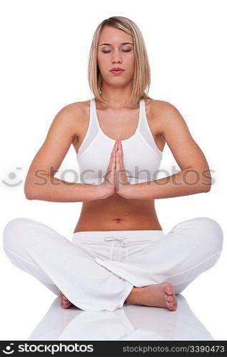 Blond young woman in yoga position on white background