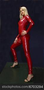 Blonde bombshel wearing a red latex catsuit.
