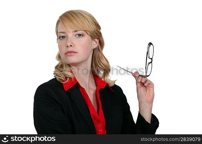 blonde businesswoman holding her head high up with glasses