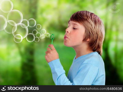 Blonde child blowing and doing bubbles . Blonde child blowing and doing bubbles in a park