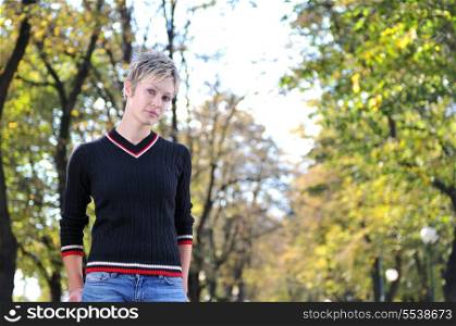 blonde Cute young woman posing outdoors in nature