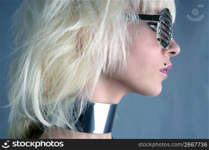 blonde fashion futuristic silver glasses girl gray background