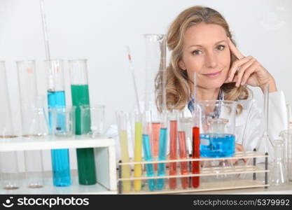 blonde female biologist posing in lab
