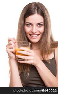 Blonde girl drinking orange juice over white