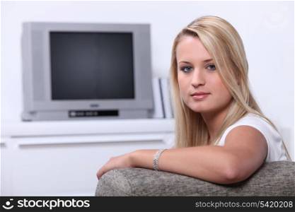 Blonde girl in front of the TV