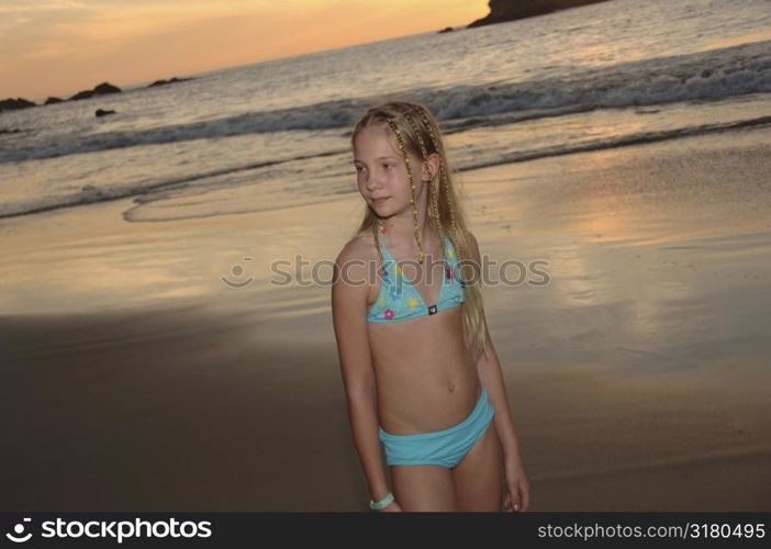 Blonde girl posing on beach