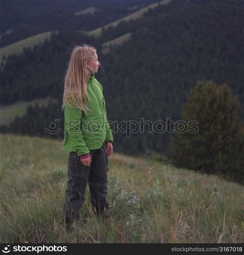 Blonde girl standing in field