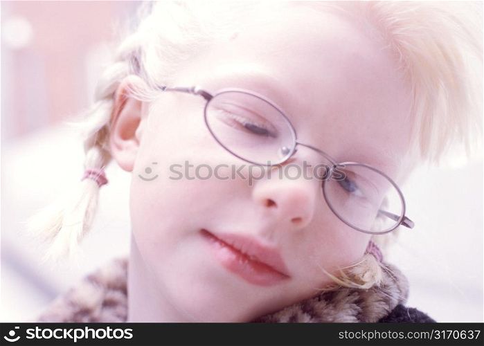 Blonde Girl With Braids and Glasses