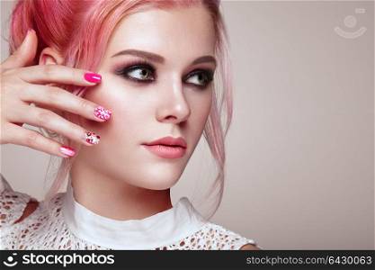 Blonde Girl with Elegant and shiny Hairstyle. Beautiful Model Woman with Curly Hairstyle. Care and Beauty Hair products. Nails and Manicure