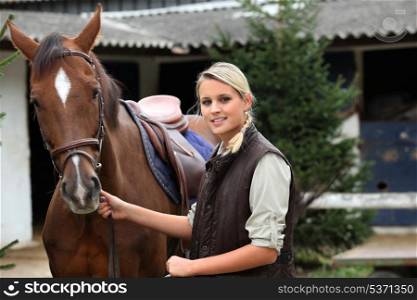 Blonde girl with horse