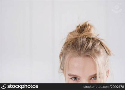 blonde girl with messy bun