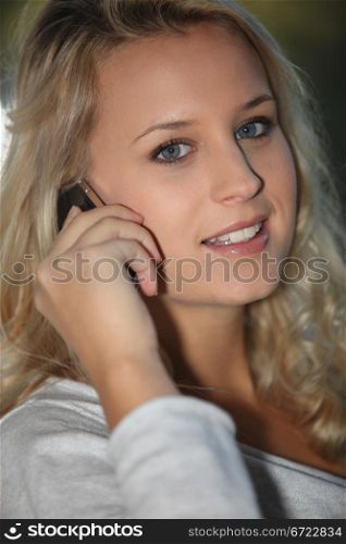 Blonde girl with mobile phone