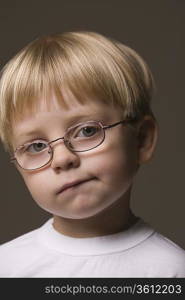 Blonde-haired boy wearing glasses