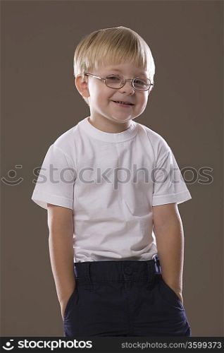 Blonde-haired boy wearing glasses, smiling