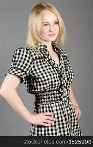 blonde in a checkered dress