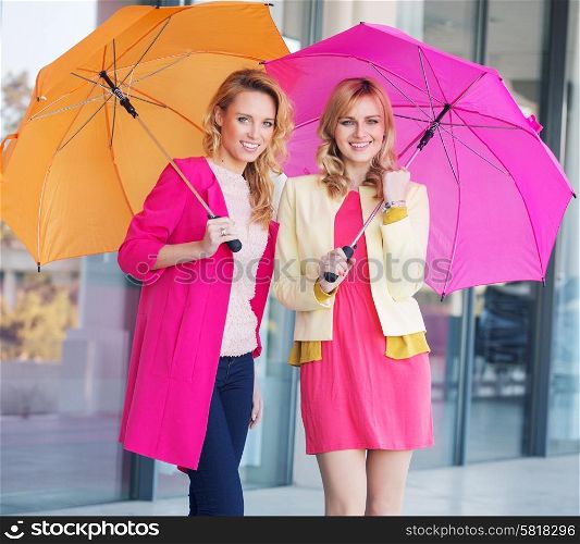 Blonde ladies with colorful umbrellas