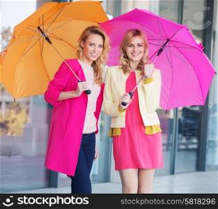 Blonde ladies with colorful umbrellas