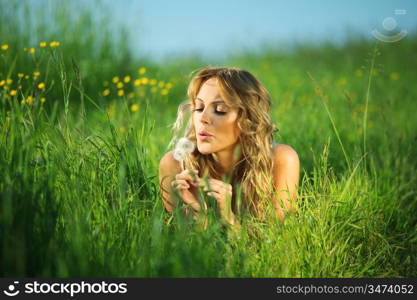blonde lays and blow on dandelion