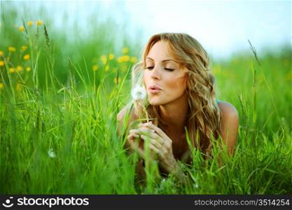 blonde lays and blow on dandelion