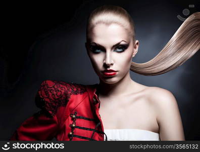 blonde sexy woman in red jacket with red lips and long tail