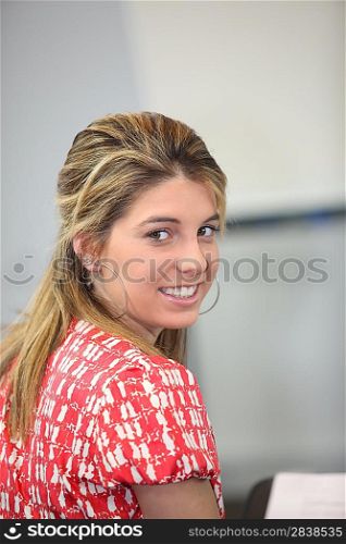 blonde student turning her face to camera
