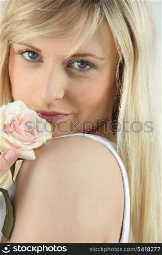 blonde woman and a rose