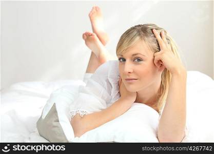blonde woman at bed