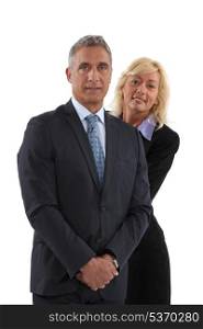 Blonde woman behind man in a suit