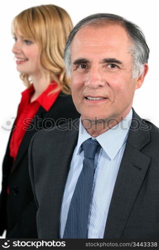 Blonde woman behind Senior man