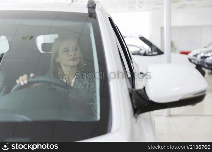 blonde woman car