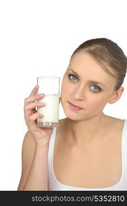 blonde woman drinking milk