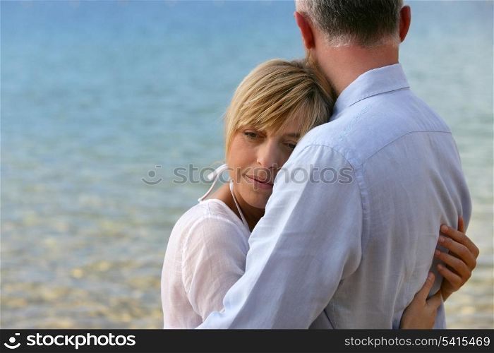 blonde woman hugging her husband