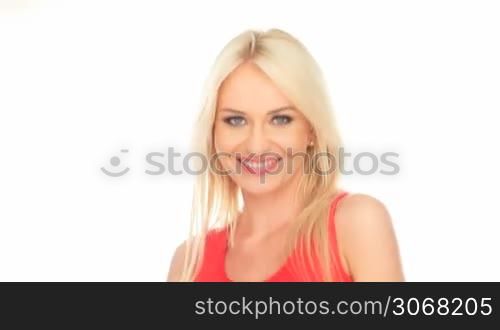 blonde woman in red top smiling on white