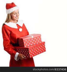 Blonde woman in Santa Claus clothes smiling with gift boxes in her hands. Young female with blue eyes, isolated on white