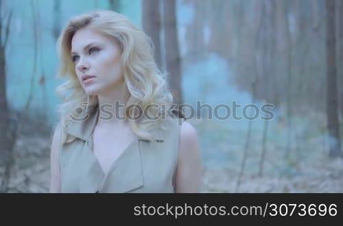 blonde woman in the forest