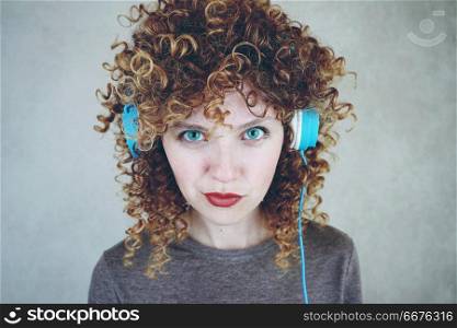 Blonde woman listening to music with her headphones