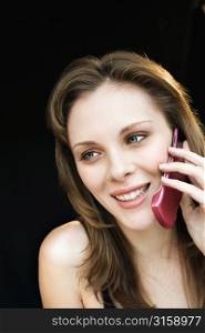 Blonde woman on pink phone