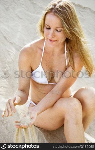 Blonde woman on the sand