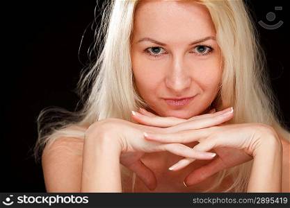 Blonde woman over dark background