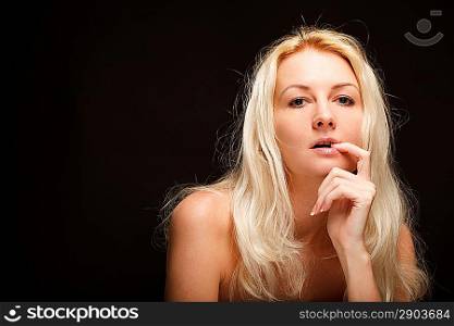 Blonde woman over dark background