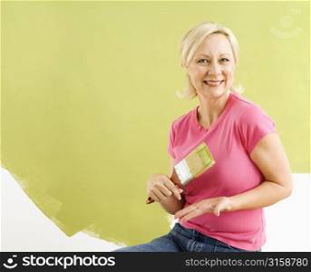 Blonde woman painting