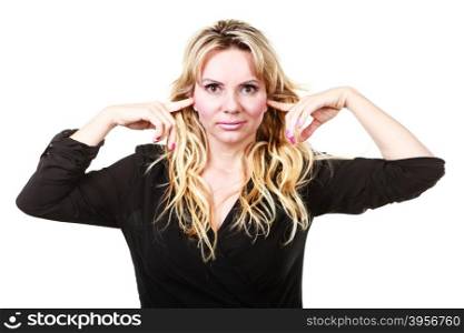 Blonde woman plug ears. Gossip and chatter. Blonde mid aged woman plug her ears on rumors. Elegant mature female in black isolated on white.