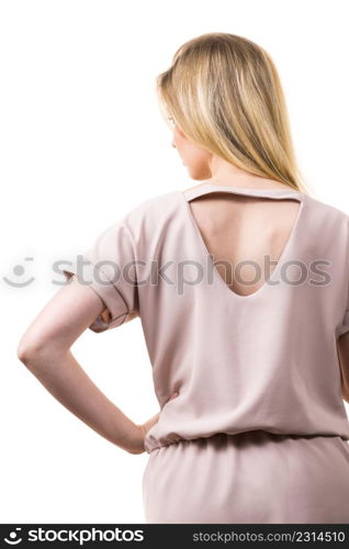 Blonde woman presenting fashionable pink top with hole detail on her back.. Woman showing hole detail on back of top