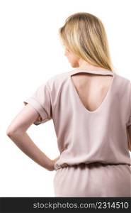 Blonde woman presenting fashionable pink top with hole detail on her back.. Woman showing hole detail on back of top