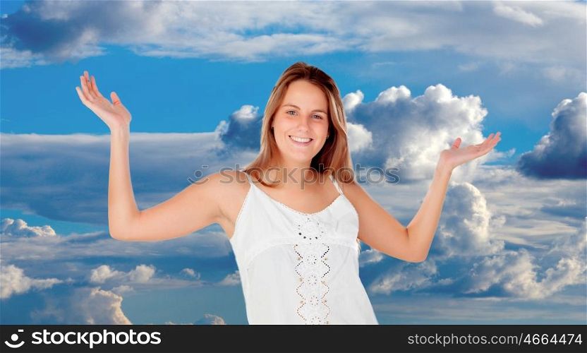 Blonde woman relaxing with a blue sky with clouds of background