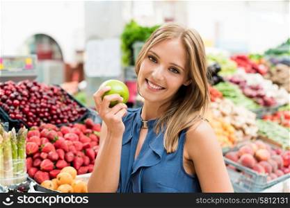 Blonde woman shopping organic veggies and fruits