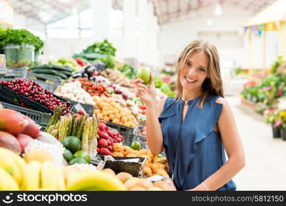 Blonde woman shopping organic veggies and fruits