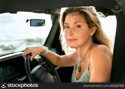Blonde Woman Sitting in Car
