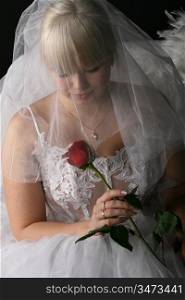 Blonde woman wearing a veil and white dress
